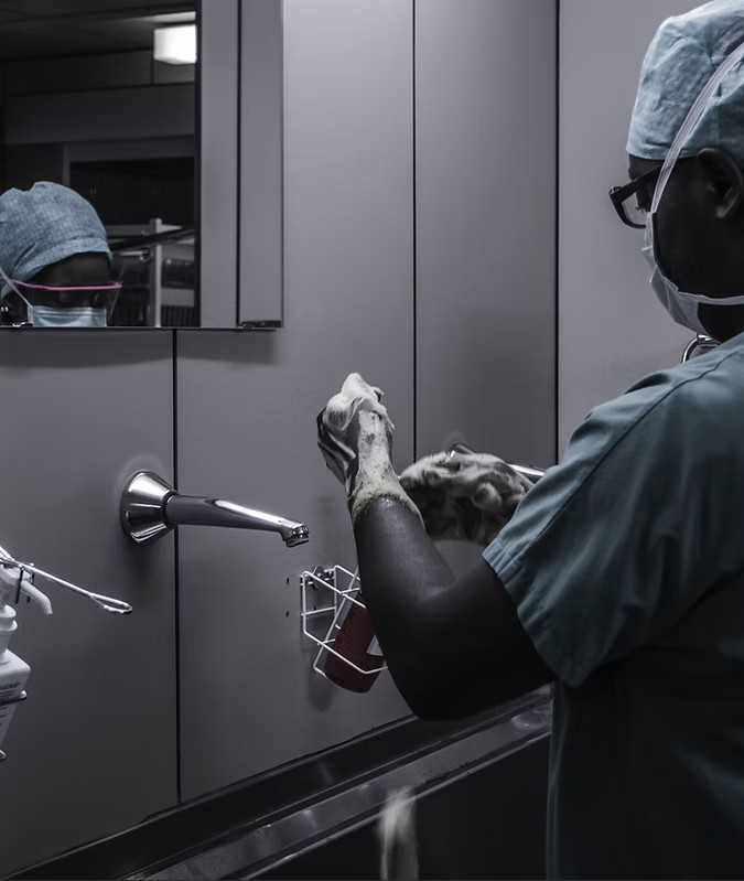 Surgical staff scrubbing in at a hospital sink