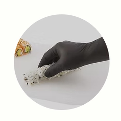 Gloved hand preparing food